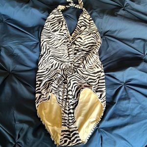 New with tags, zebra print one piece. Twist front.